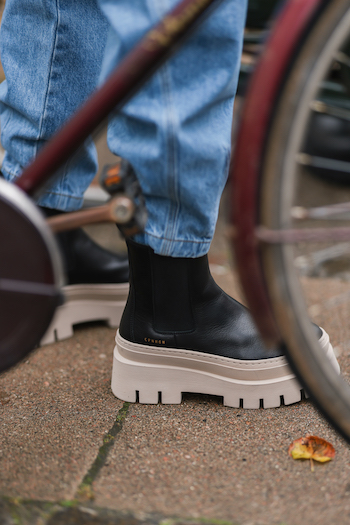 Picture from a boot from Copenhagen Studios A/W Collection 2021. Black Boot with a nature toned sole. From a Street Style Shooting.