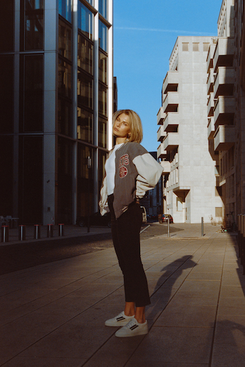 Campaign Picture from our Analogue Street Style Shooting. Model is wearing new skater sneakers from Copenhagen Studios CPH687 white a college jacket.