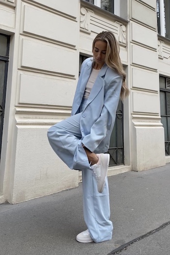 @christinabiluca is wearing a pastel blue oversized suit in combination with her CPH461 leather mix white/powder sneaker.