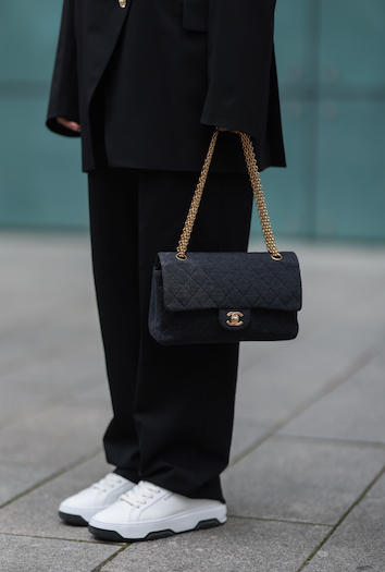 @aylin_koenig at the Copenhagen Studios Hamburg store opening. She wears an entirely black look with an oversized suit and her CPH Hamburg 1 vitello white/black.