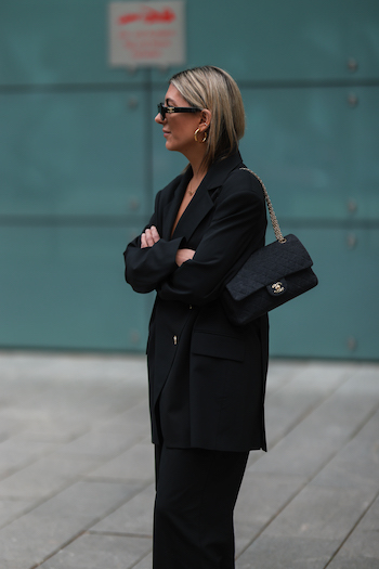 @aylin_koenig at the Copenhagen Studios Hamburg store opening. She wears an entirely black look with an oversized suit and her CPH Hamburg 1 vitello white/black.