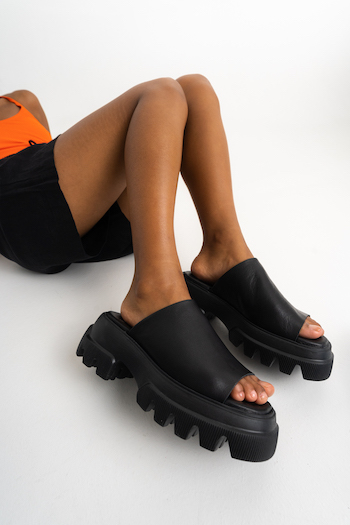 CPH231 in vitello black with a black shorts and a neon orange top.
