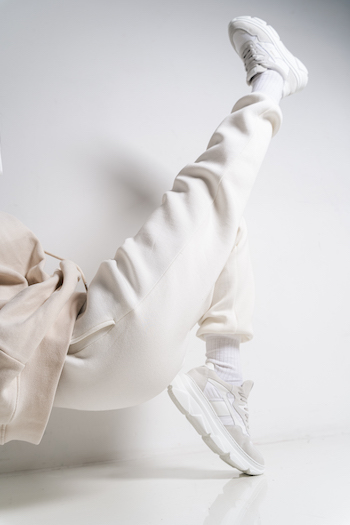 Model is wearing cph51 material mix white with a white jogger. White background.