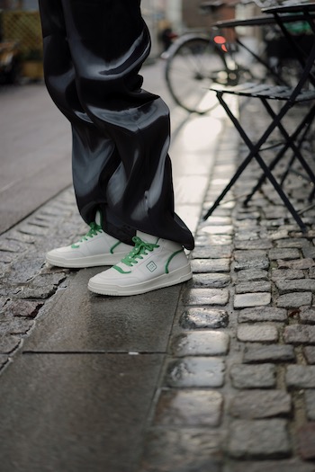 The young male influencer Erik Scholz is standing on the streets of Copenhagen wearing the CPH196 vitello white green. 