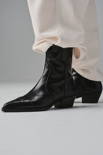 a woman in beige trousers wearing our soon launching CPH239 vitello black.