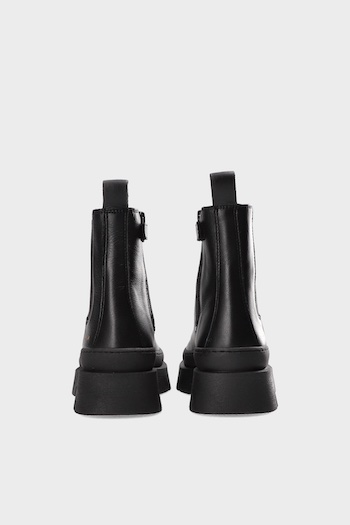 Both black boots shown from the back. Black leather and chunky soles.