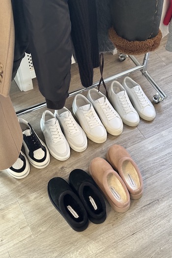 The wardrobe with several CPH Styles laying in front of it.