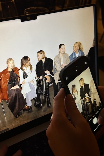 Behind the Scenes of the Show with several international Creators sitting at the show.