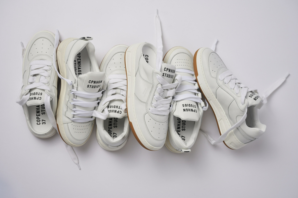 The picture shows our new retro skater collection - The CPH213 soft vitello white! The shoes are positioned next to each other and overlap at some points.