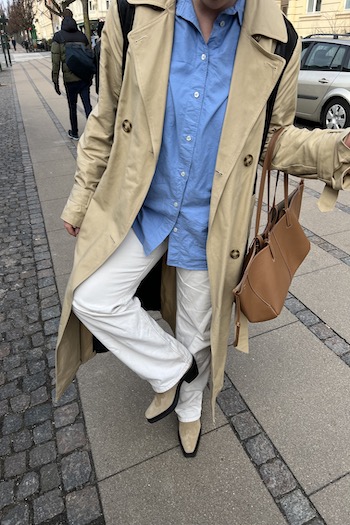 Copenhagen based Creator Maria Jonsson styling the CPH233 suede sand to a beige trenchcoat, blue shirt and white loose jeans.