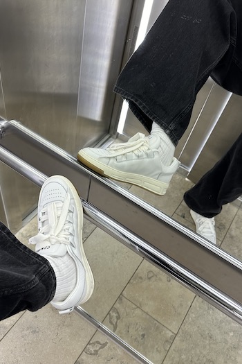 The female creator Marleen taking one elevator picture with our CPH213 soft vitello white in focus. 