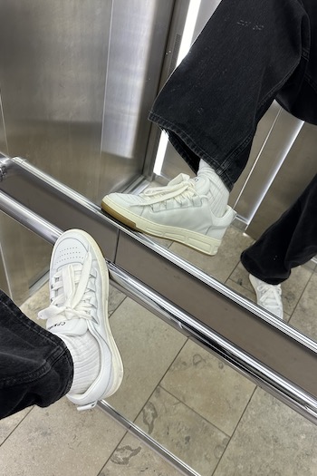 The female creator Marleen taking one elevator picture with our CPH213 soft vitello white in focus.