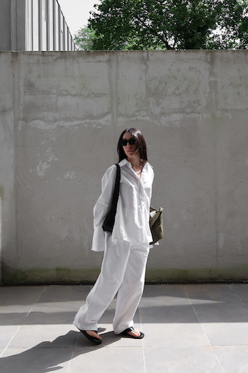 In the image, Sophia styled our CPH791 nappa black to an all white shirt and pants combined with a black purse and sunglasses.