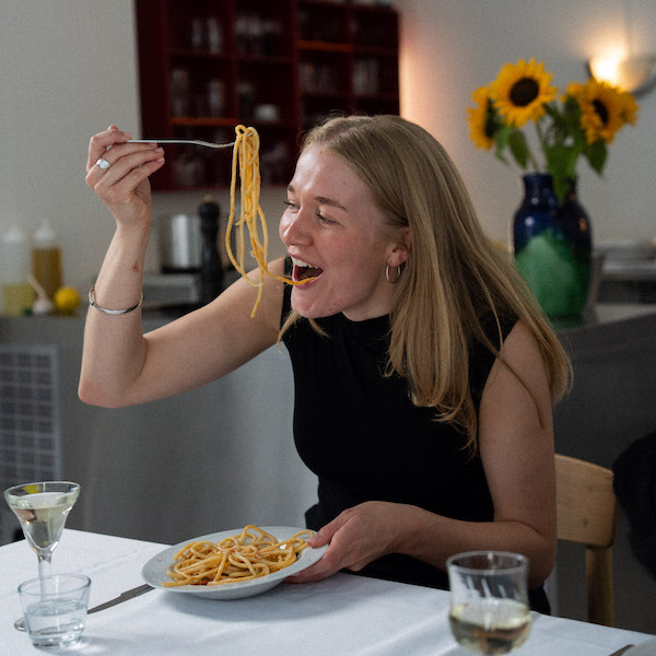 In this image Copenhagen-based chef Klara is eating pasta.