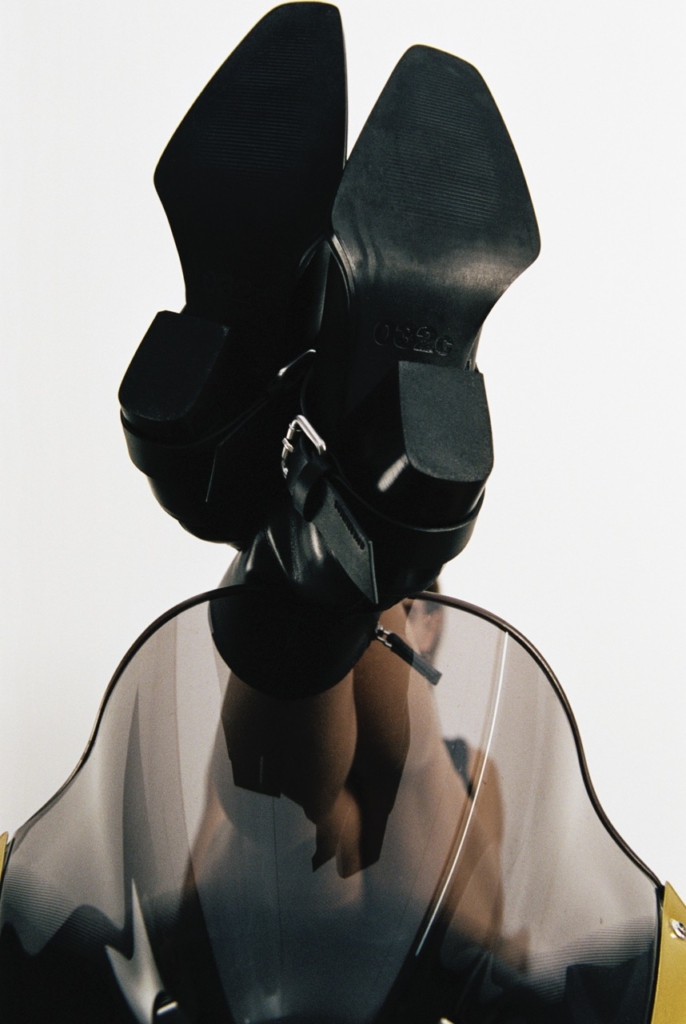 This image shows the soles of the CPH x 032c ANKLE leather black with its custom leather sole featuring the 032c branding and custom hardware metal buckle.